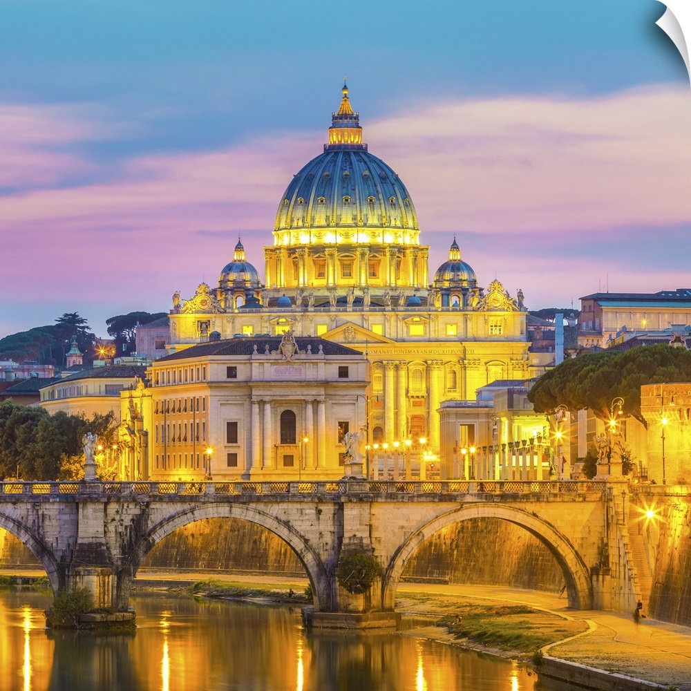 Night view of old roman bridge of Hadrian and St. Peters cathedral in Vatican city Rome, Italy.