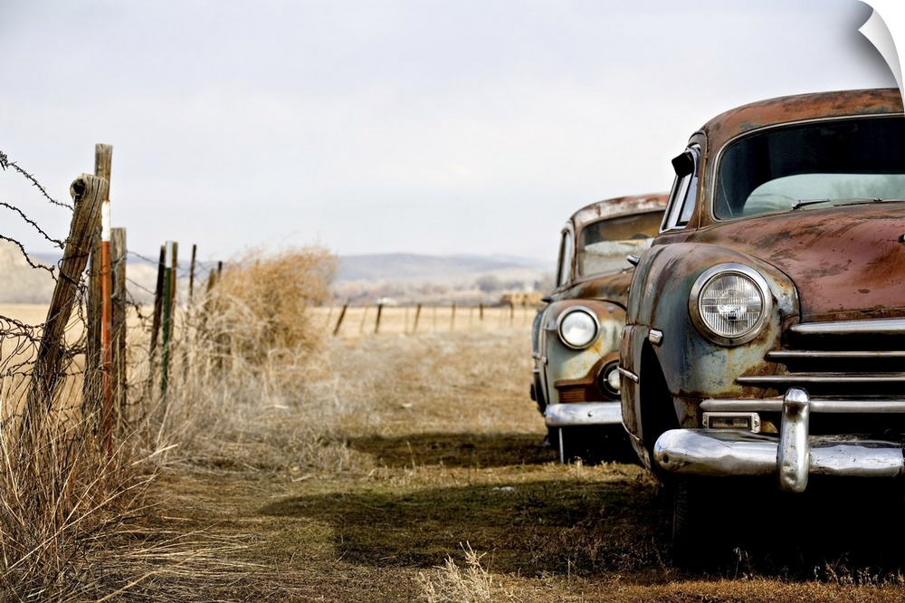 Vintage cars abandoned and rusting away in rural Wyoming.