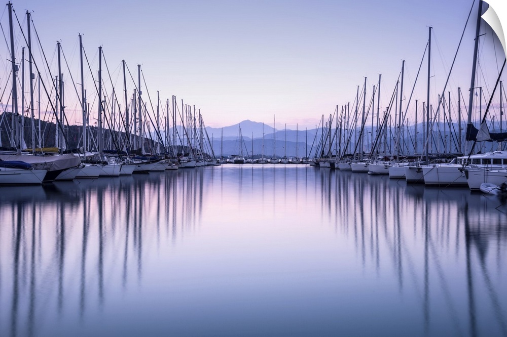 Large yacht harbor in purple sunset light, luxury summer cruise, sailboats in sunrise, leisure time, active life, vacation...