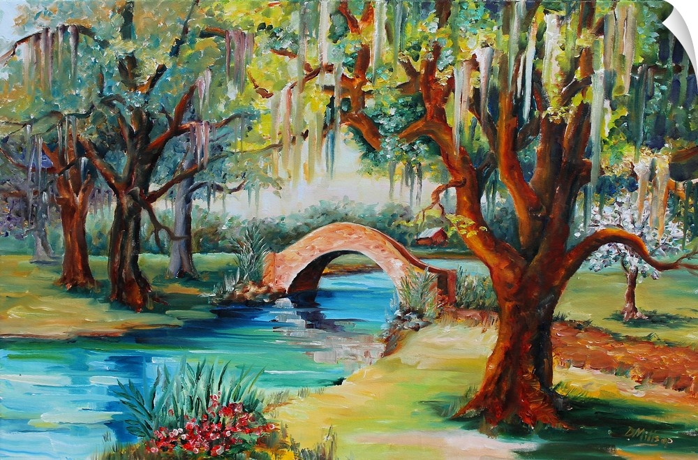 A park with a small stone bridge over a stream and a live oak tree.