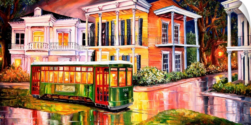 Bright colors are used to paint vintage homes on a street that appears wet as the homes and a trolley reflect in it.