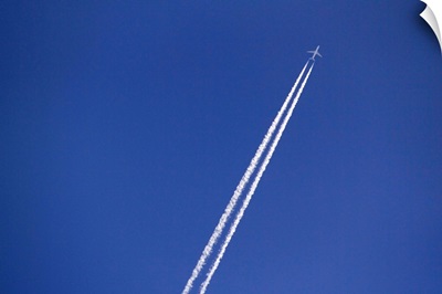 Airplane and vapor trail