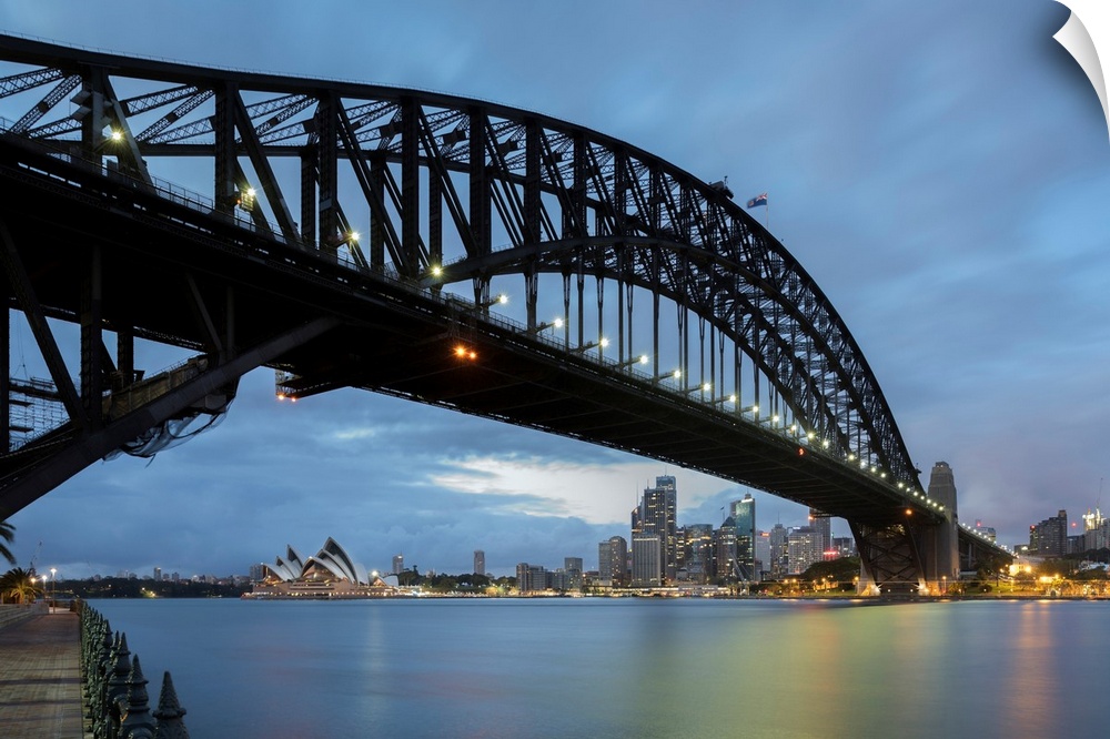Australia, New South Wales, Sydney, Sydney Harbor Bridge, The famous bridge at dawn, view with the Sydney Opera House in t...