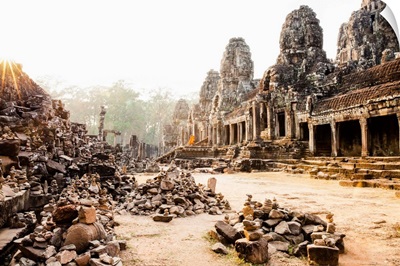 Cambodia, Siemreab, Angkor, Monks leaving the Bayon Temple at sunset