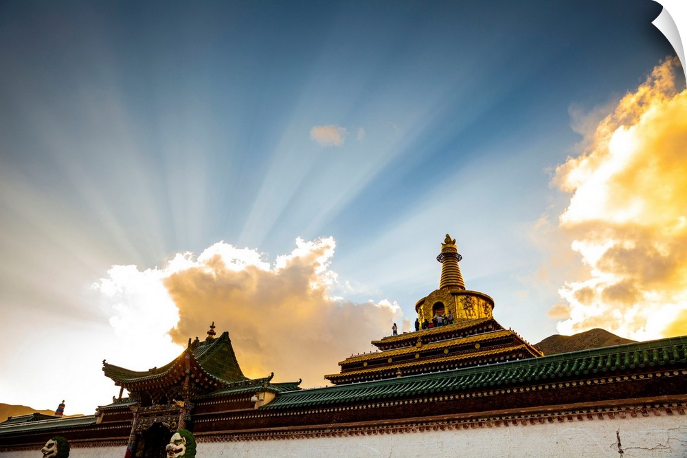 China, Gansu, Xiahe, Ray of sunlight over the Gong Tang pagoda of Labrang Monastery.