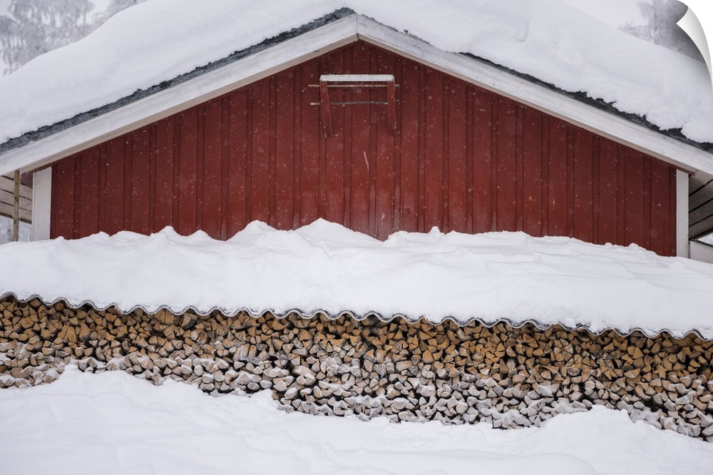 Finland, Lapland, Typical house with a stack of firewood, Kittila, Scandinavia.