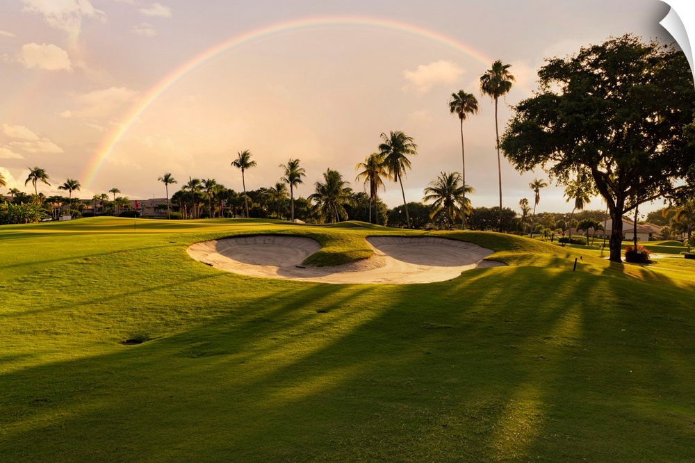 Florida, Boca Raton, golf course with palm trees & rainbow.