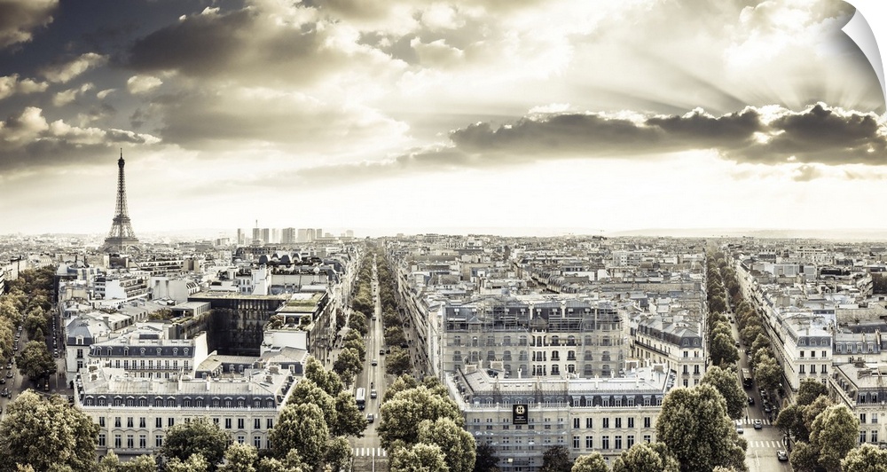France, Paris, Champs Elysees, Cityscape from the Arc de Triomphe, Eiffel Tower in the background at sunset.