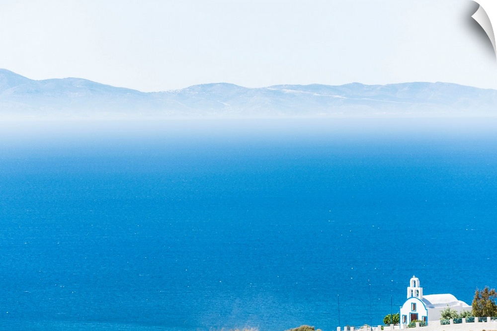 Greece, Cyclades, Santorini island, A typical Greek orthodox church on the Cyclades island Santorini with the Mediterranea...