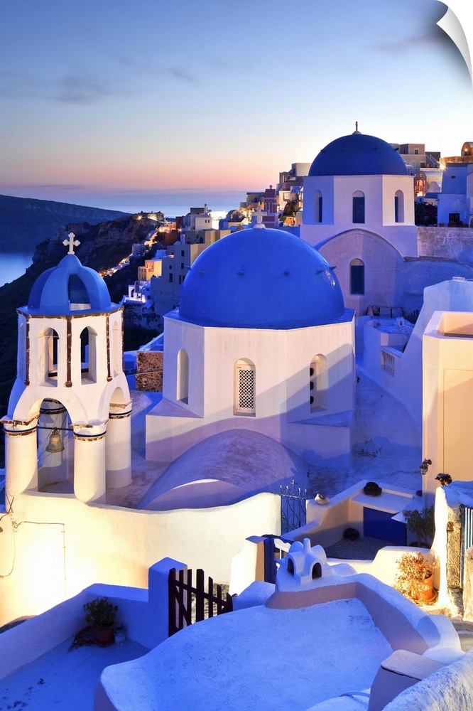 Greece, Aegean islands, Cyclades, Santorini island, Greek Islands, Typical church in Oia village at dusk.