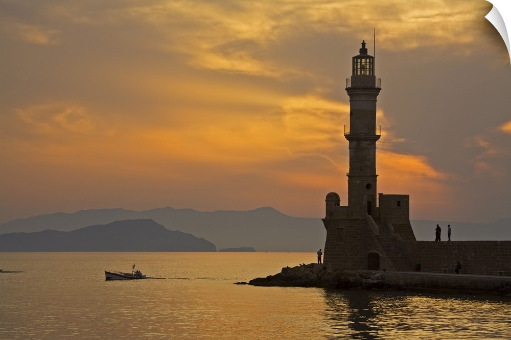 Greece, Crete, Chania, Venetian lighthouse in Chania harbor at sunset