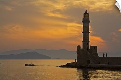 Greece, Crete, Chania, Venetian lighthouse in Chania harbor at sunset