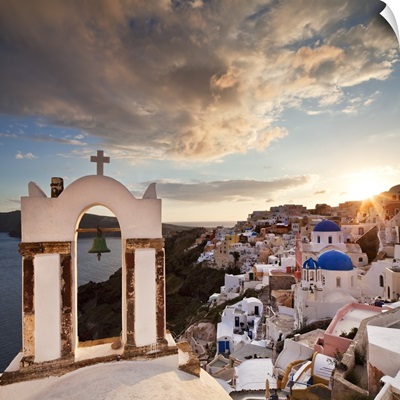 Greece, Santorini island, Oia, typical church bell overlooking the village at sunset