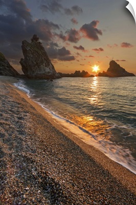 Italy, Calabria, Mediterranean sea, Palmi, Ulivarella Rocks at sunset