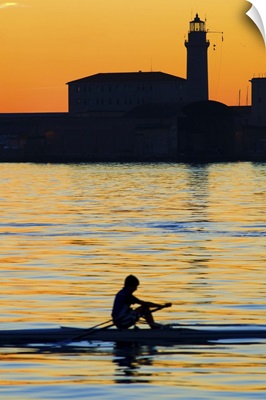 Italy, Friuli-Venezia Giulia, Trieste, Sunset on the sea with Lanterna and canoe