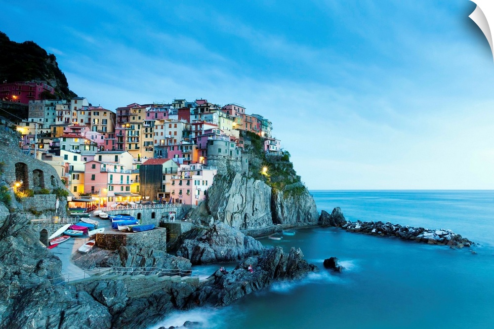 Italy, Liguria, La Spezia district, Riviera di Levante, Cinque Terre, Parco Nazionale delle Cinque Terre, Manarola at dusk.