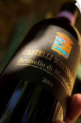 Italy, Tuscany, Castelli Martinozzi wine cellar, Brunello di Montalcino wine bottle
