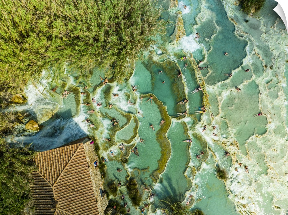 Italy, Tuscany, Grosseto district, Maremma, Saturnia, Amazing top view of the Saturnia thermal baths full of people relaxi...