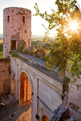 Italy, Umbria, Spello, Porta Venere (gate) and Torri di Properzio (towers) at sunset