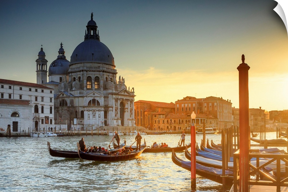 Italy, Venice, Gondolas and the Santa Maria della Salute church at sunset.