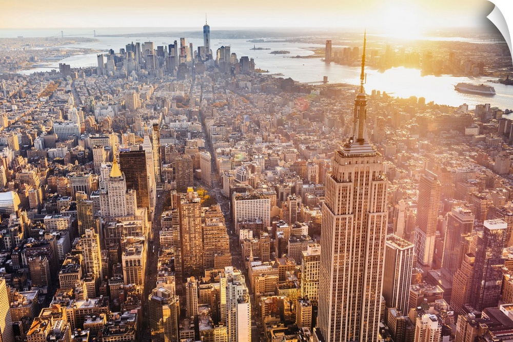 USA, New York City, Manhattan, Midtown, Aerial view towards Empire State Building and One World Trade Center at sunset