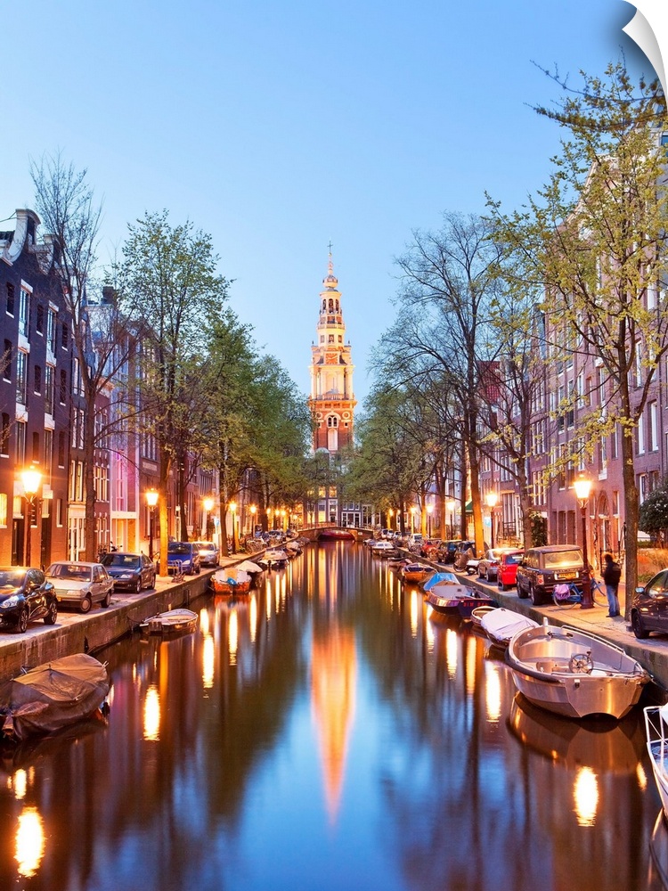 Netherlands, North Holland, Benelux, Amsterdam, Montelbaan Tower at Oude Schans illuminated at dusk.