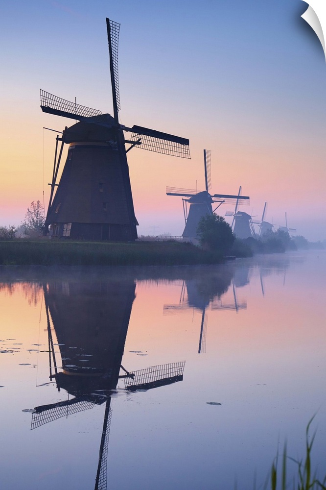 Netherlands, South Holland, Kinderdijk, Windmills at sunrise.