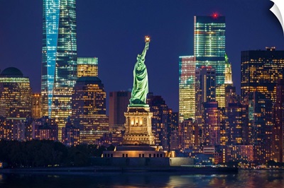 New York City, Liberty Island, Manhattan Skyline And Statue Of Liberty At Night