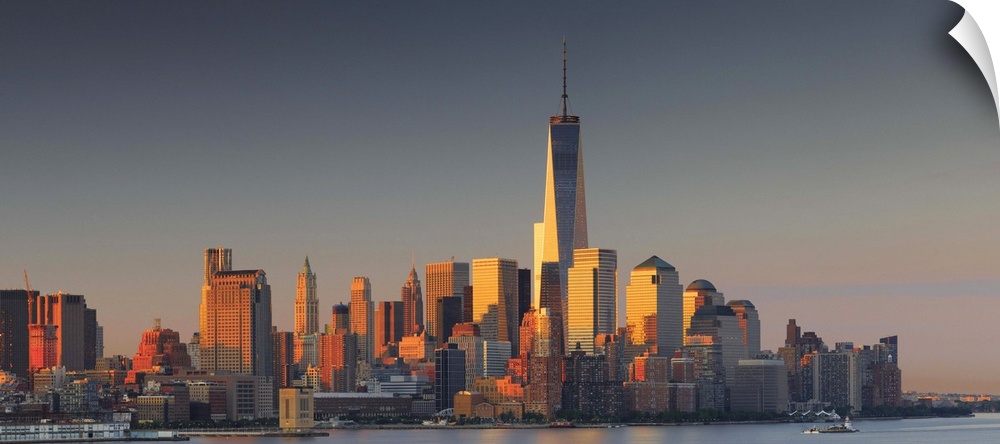 USA, New York City, Manhattan, Lower Manhattan, One World Trade Center, Freedom Tower, City skyline at sunrise.