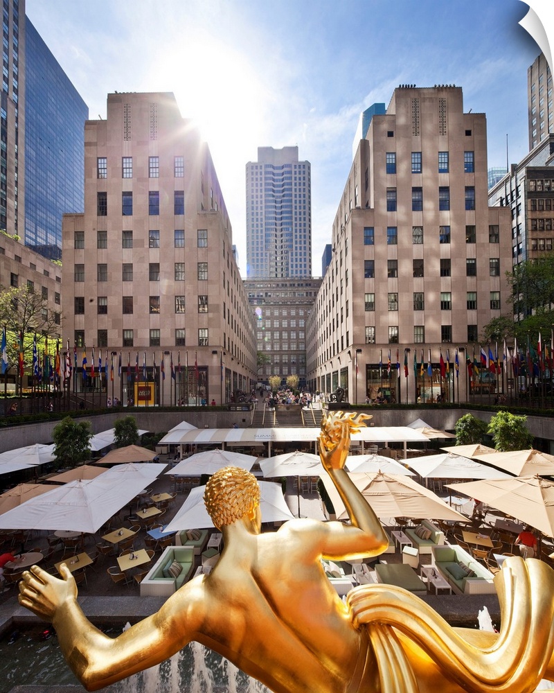 USA, New York City, Manhattan, Midtown, Rockefeller Center, Prometheus Statue facing The Rink cafe.