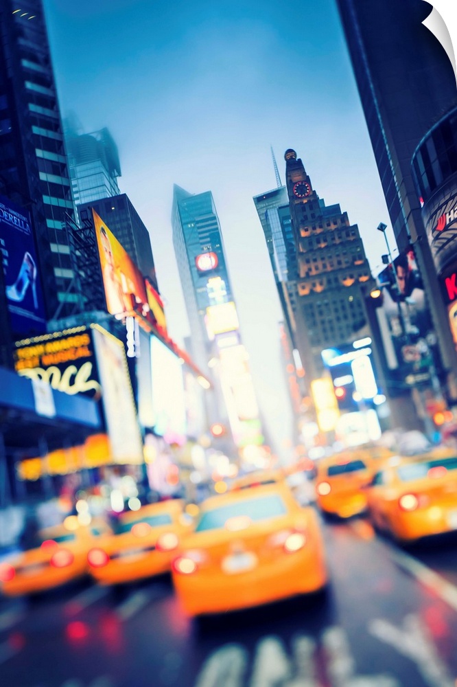 New York, New York City, Manhattan, Times Square, Yellow taxi cabs at night.