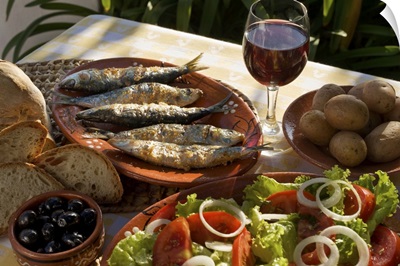 Portugal, Typical rustic Algarve meal, grilled sardines, bread, salad & a glass of wine