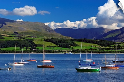 UK, Wales, Anglesey, Sailing boats in the Menai Strait, with the Snowdon range