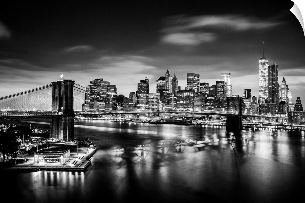 USA, New York City, Brooklyn Bridge and Manhattan skyline with One World Trade Center at sunrise.