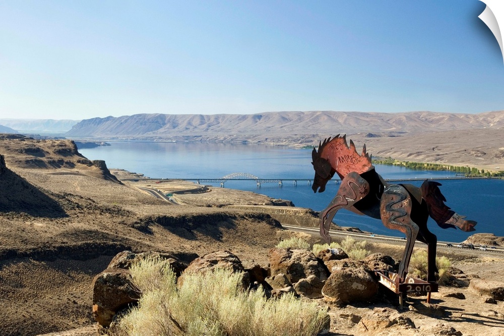 USA, Washington, Vantage, metal sculpture of wild horses overlooking Columbia River.