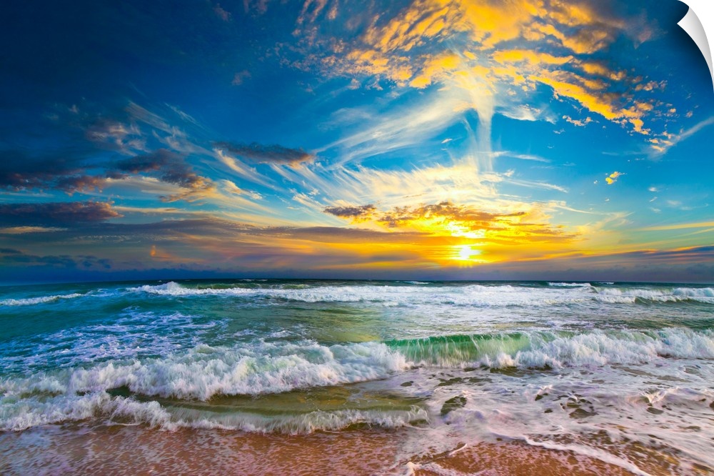 This beautiful beach sunset pictures the eternal sea as it disappears into a beautiful yellow sunset. Crashing waves hit t...