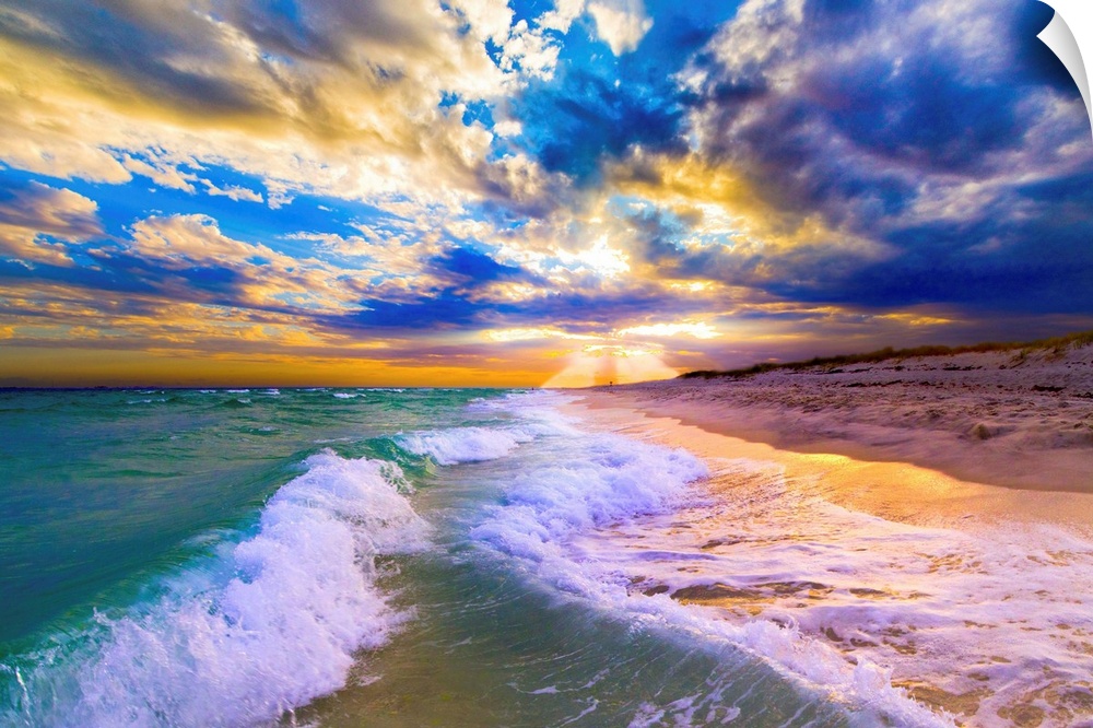 Breaking waves over a blue beach under a sunset in Florida.
