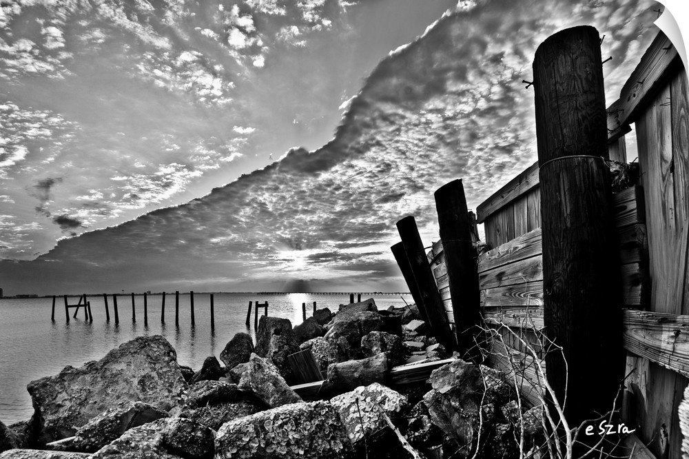 A broken sea wall in vintage black and white.