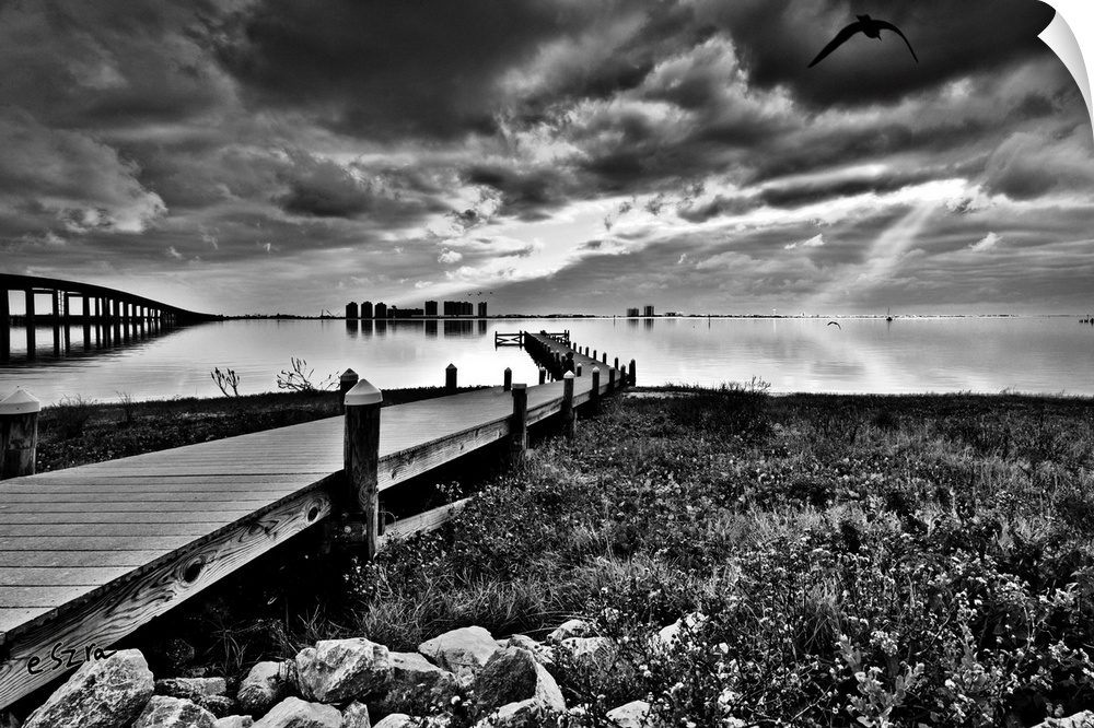 A black and white landscape of the fishing pier at Navarre children's park, Florida.