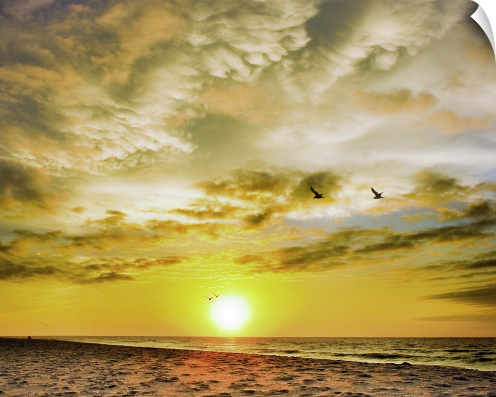 A beautiful Destin Beach Sunrise with orange and white clouds.