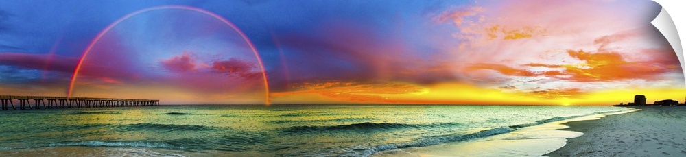 A wide panorama of a double rainbow over the beach in Florida.
