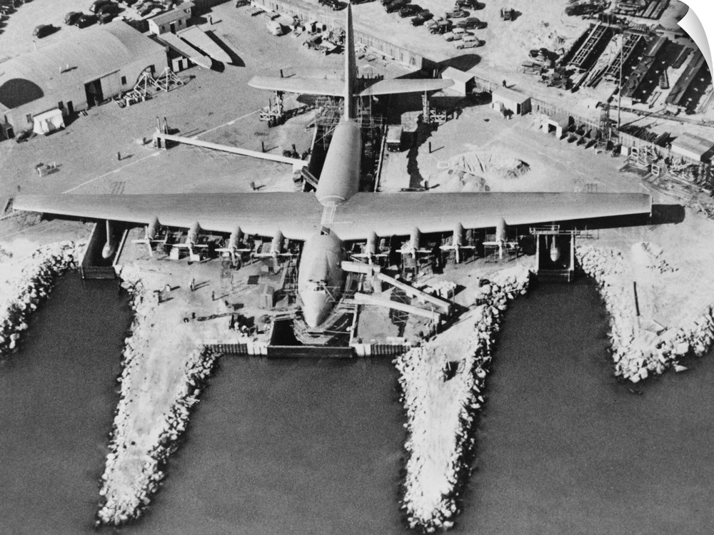 Aerial view of Hughes Flying-boat seaplane under construction at its dock in Long Beach, 1947. The prototype was named 'Hu...