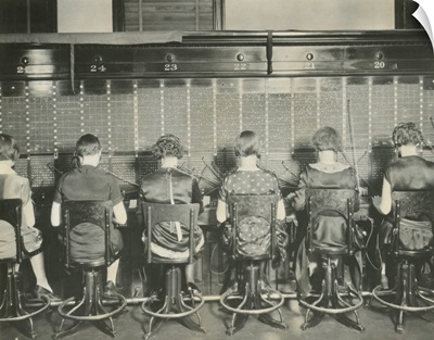 Back view of young women telephone switchboard operations. Washington