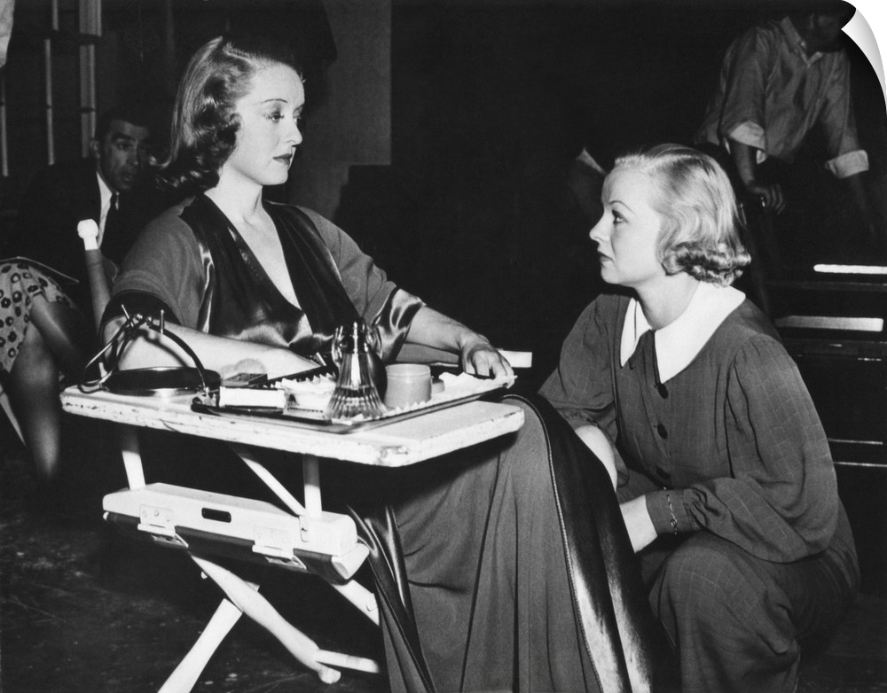 Betty Davis with her stand-in Sally Sage on the set for 'That Certain Woman'. Sage worked as a stand-in for four years and...