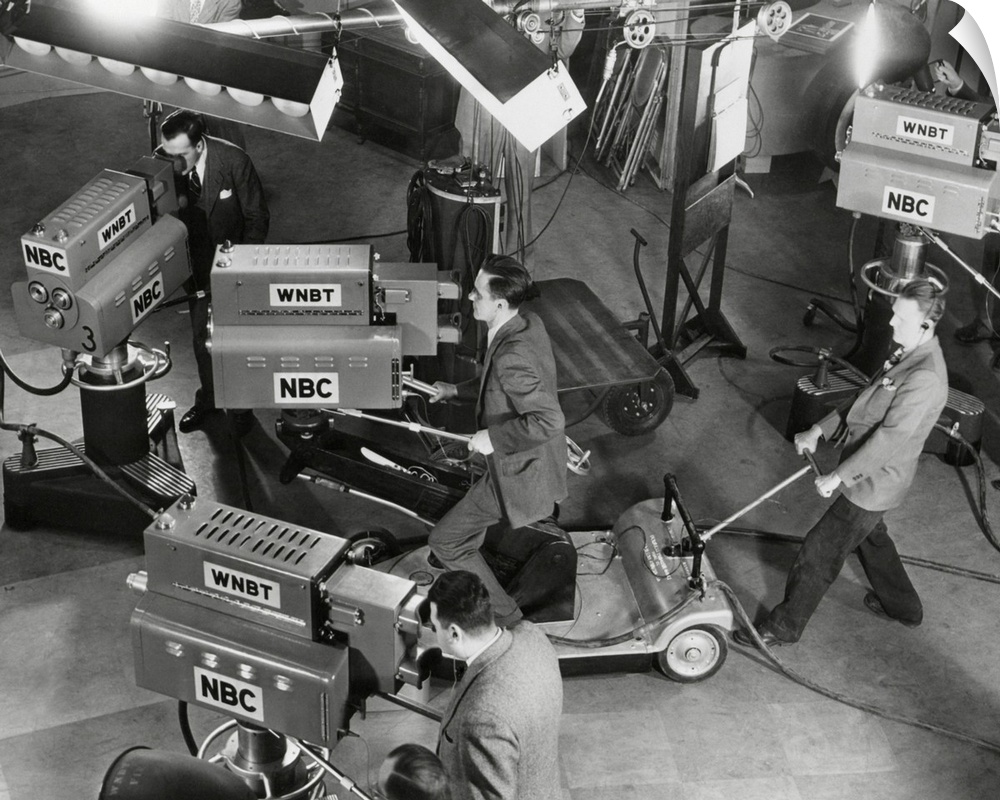 Cameras are tested on the television studio set before the program goes on the air.