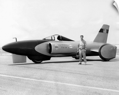 Craig Breedlove stands beside his jet car 'Spirit of America'