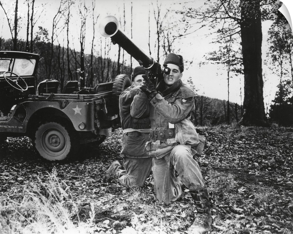 Elvis Presley training with a bazooka while on maneuvers in Germany. He served in Germany from October 1, 1958, until Marc...