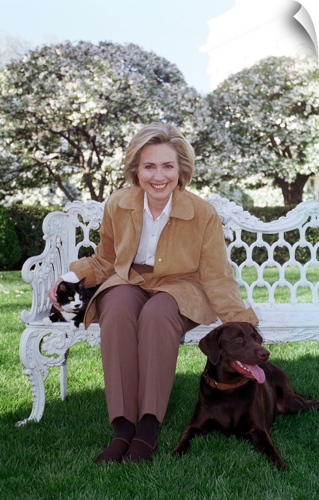First Lady Hillary Rodham Clinton with Socks the Cat and Buddy the Dog on the White House Lawn. April 7, 1999.