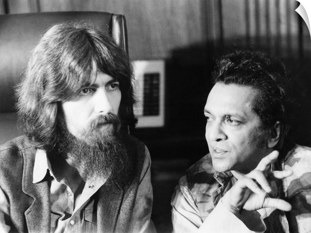 Former Beatle George Harrison and Indian musician Ravi Shankar talk to newsmen in New York. July 27, 1971. Their planned c...
