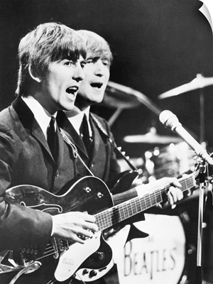 George Harrison (left) and John Lennon of the Beatles, c. 1964